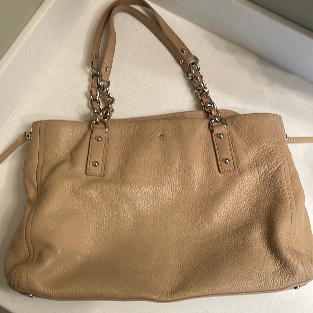 Kate Spade tan leather handbag with gold chain and leather straps.